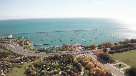 Chicago,-Illinois-Lake-Michigan-and-cars-driving-on-Lakeshore-Drive-with-drone-video-moving-forward
