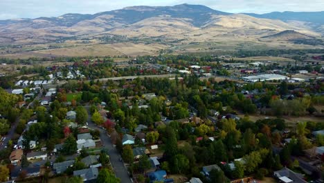 US,-Oregon,-Ashland---Drone-shot-of-the-city-of-ashland-with-Grizzly-Peak-in-the-distance