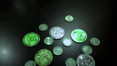 Bitcoin-and-Polkadot-coins-mixed-with-green-euro-coins,-bull-market-to-the-moon-on-blockchain-web-3,-digital-payments,-light-reflections,-rolling-foreground-shot-backwards-and-backs,-Galicia,-Spain