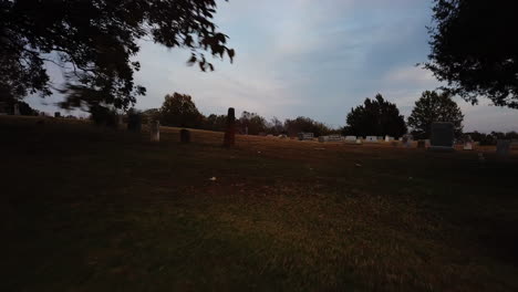 Exploration-shot-through-a-graveyard-during-dusk