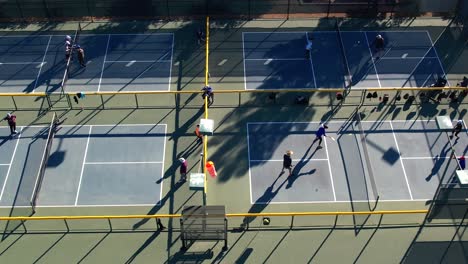 Aerial-Overhead-Shot-Of-People-Playing-On-Four-Pickleball-Courts
