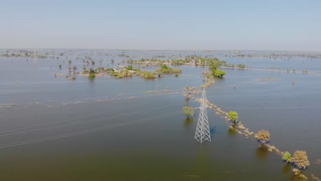 Aerial-View-Electricity-Pylon-Under-Flood-Water-In-Jacobabad,-Pakistan