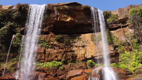 pristine-natural-waterfall-falling-from-mountain-top-at-forests-at-day-from-different-angle-video-is-taken-at-phe-phe-fall-meghalaya-india