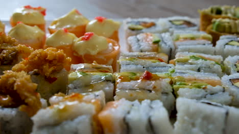 Close-up-trucking-slider-shot-of-delicious-looking-mixed-sushi-platter