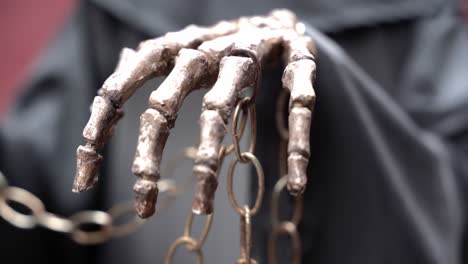 Bones-of-a-hand-holding-a-chain