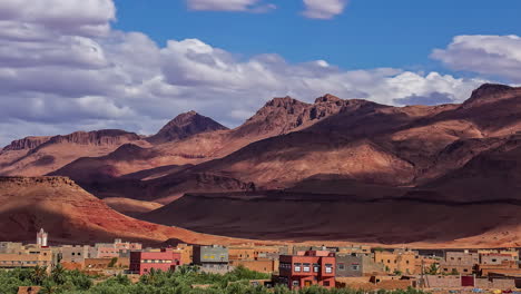 Cinematic-timelapse-of-moving-clouds-and-shadows-falling-on-the-high-atlas-mountain-of-Tinghir-town,-the-Moroccan-crown-jewel