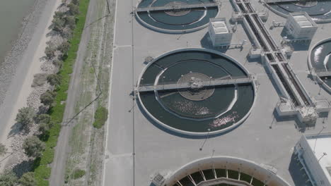 Slow-aerial-pan-to-the-right-of-a-water-treatment-plant-in-Los-Angeles,-CA