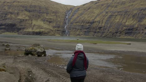 Wide-of-a-Woman-Staring-Out-Into-a-Valley-in-the-Faroe-Islands