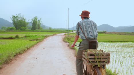 POV-driving-on-rough,-rural-and-closed-road-between-the-farmfields-at-Lang-Son-city,-Vietnam