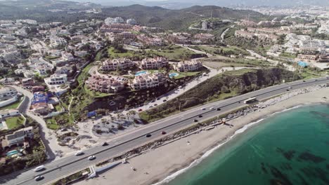Aerial-drone-of-beach-front-at-the-coastal-town-of-Fuengirola,-Malaga,-Spain