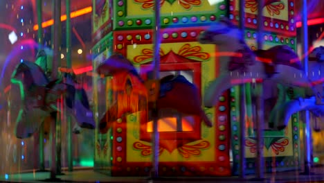 Horses-going-around-a-carousel-in-an-amusement-arcade-at-a-fairground-carnival