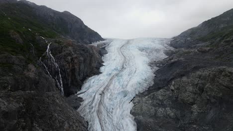 Aerial-view-over-a-shrinking-glacier---global-warming-and-climate-change-in-progress