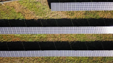 Aerial-View-Of-The-Solar-Panel-In-Solar-Farm-For-Green-Energy---drone-ascending