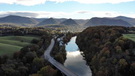 Aerial-footage-above-a-river-and-entering-a-small-town-in-the-Appalachian-mountains