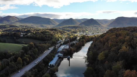 Aerial-footage-above-a-river-and-entering-a-small-town-in-the-Appalachian-mountains