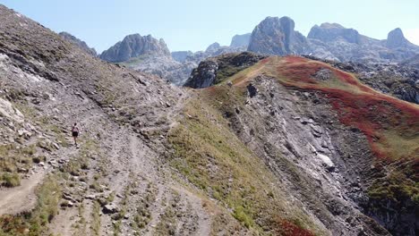 Woman-Hikes-a-Mountain-Trail-in-Prokletije-National-Park,-Montenegro---Dolly