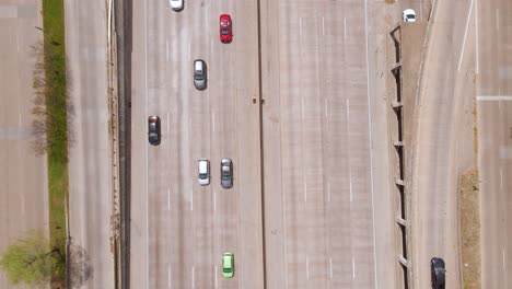 Aerial-view-above-cars-on-the-Texas-State-Highway-Spur-366,-in-sunny-Dallas,-USA---birds-eye,-drone-shot