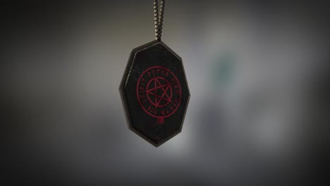 High-quality-close-up-render-of-an-unusual-metal-and-stone-Pagan-pentacle-amulet-with-runes,-swinging-slowly-on-the-end-of-a-neck-chain,-with-super-shallow-depth-of-field-abd-bokeh-background