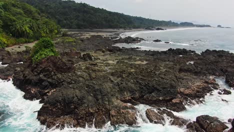 Drone-Footage-Of-Blue-Pacific-Ocean-Waves-Crashing-Into-Rocky-Shoreline-in-Choco-Colombia