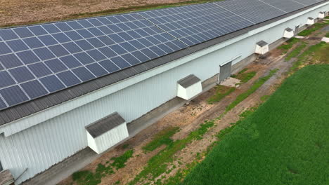 Chicken-house-poultry-barn-with-solar-panel-array-on-rooftop-in-USA