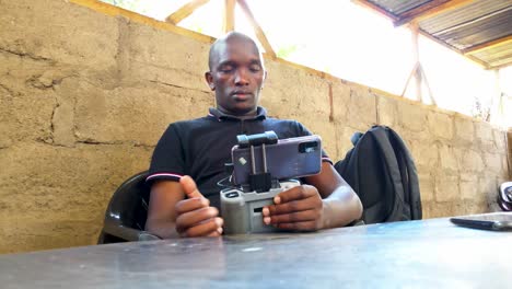 An-African-drone-pilot-flying-drone-in-rural-Africa