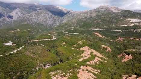 Mountain-Landscape-and-Coastal-Road-at-Gjipe-Canyon,-Albania---Aerial