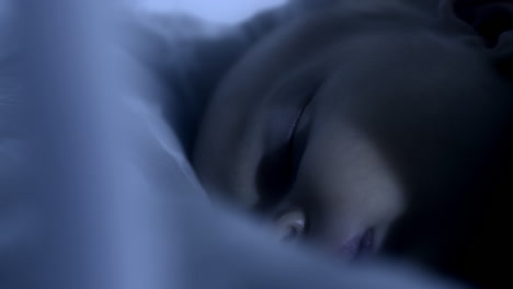 Baby-girl-sleeps-peacefully-at-night,-close-up