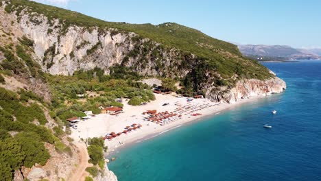 White-Sandy-Gjipe-Beach-and-Canyon,-Albania---Aerial-Circling-Pan