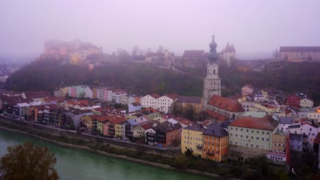 Historic-old-town-of-Burghausen-with-the-worlds-longest-castle-illuminated-in-the-fog