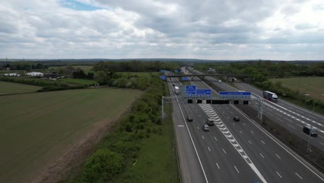 Overhead-motorway-signage-on-M1-UK-drone-aerial-view-reveal