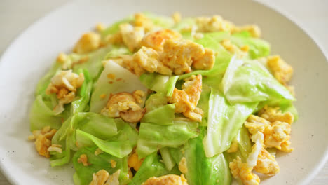 homemade-stir-fried-cabbage-with-egg-on-plate