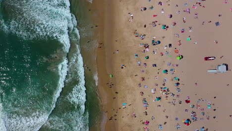 birds-eye-view-shot-of-manhattan-beach-filled-with-people