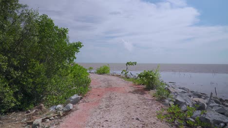 Dirt-path-in-front-of-the-blue-sea