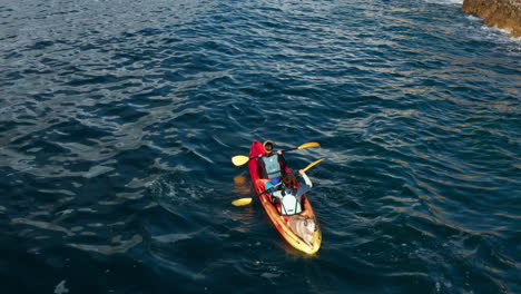 People-Kayaking-In-The-Ocean---aerial-drone-shot