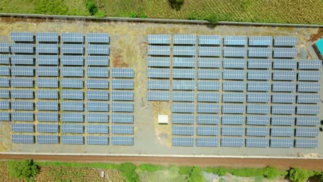 Flying-low-over-solar-panels-on-farm-in-rural-Africa