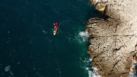 Bird's-Eye-View-Of-Kayak-In-The-Sea-In-Pula,-Istria,-Croatia---drone-shot