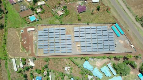 Drone-flying-over-solar-panel-cell-farm-in-kenya