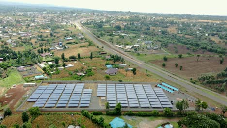 Flying-low-over-solar-panels-on-farm-in-rural-Africa