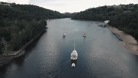 3-yachts-anchor-peacefully-in-Middle-Harbour,-Sydney