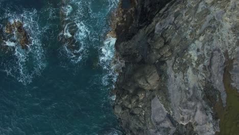 Maui-Hawaii-rocky-coastline-overhead-drone-4k-slow-pull-back