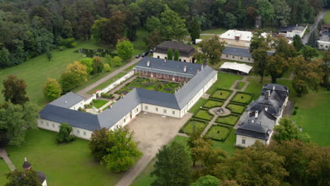 Beautifully-manicured-gardens-at-the-private-wedding-venue,-Chateau-Bon-Repos,-aerial-rise-and-reveal