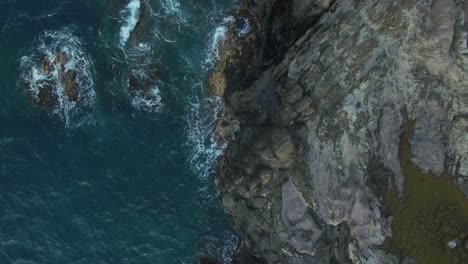 Maui-Hawaii-rocky-coastline-overhead-drone-4k-slow-pull-back,-wider