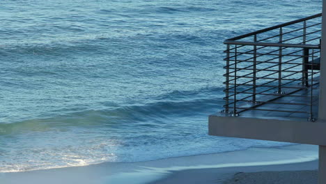 Hotel-Balcony-with-Ocean-Waves-Meeting-The-Shoreline-Of-Beach