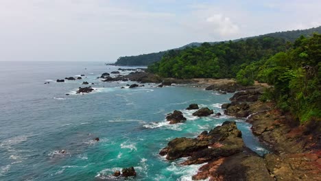Beautiful-Tropical-Jungle-Pacific-Ocean-Coast-With-Turquoise-Blue-Water-Waves-Crashing-Onto-Rocky-Shore
