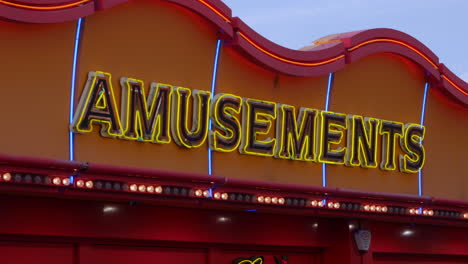 Amusement-arcade-sign-above-a-casino-on-a-cloudy-day
