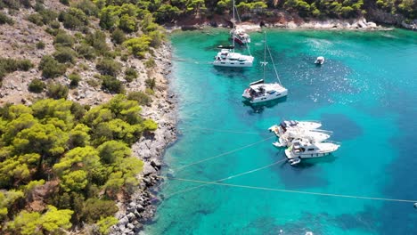 Aerial-drone-video-of-small-bay-of-Mpisti-in-picturesque-island-of-Ydra-or-Hydra,-Saronic-gulf,-Greece