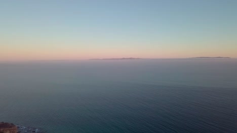 Aerial-view-over-ocean-surface-with-waves-aerial,-horizon
