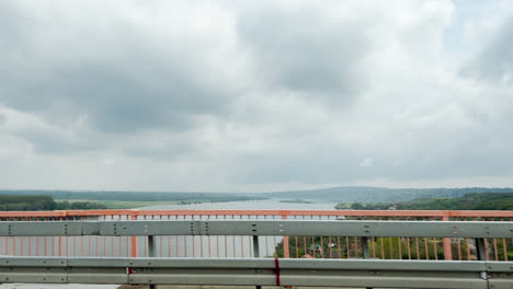 Crossing-the-Beska-bridge-over-Danube-river-on-A1-motorway-part-of-the-European-route-E75-between-Belgrade-And-Novi-Sad-in-Serbia