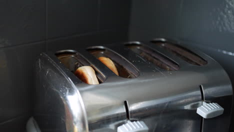 Bagel-being-toasted-in-a-toaster-oven-and-popping-up