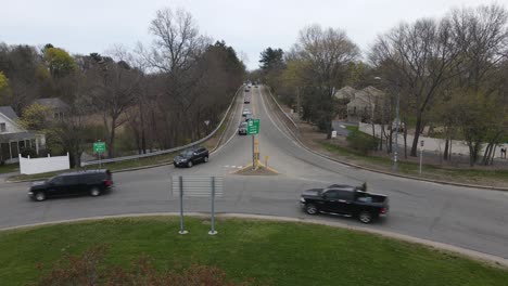 Low,-static-drone-view-of-traffic-on-a-two-lane-roadway-in-New-England